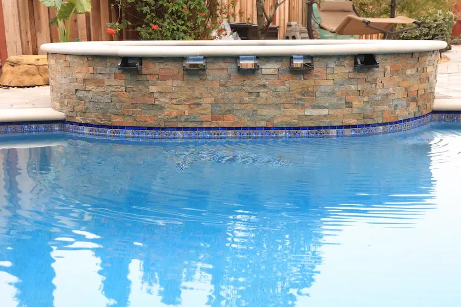 Water features can transform a pool into a relaxing space year round
